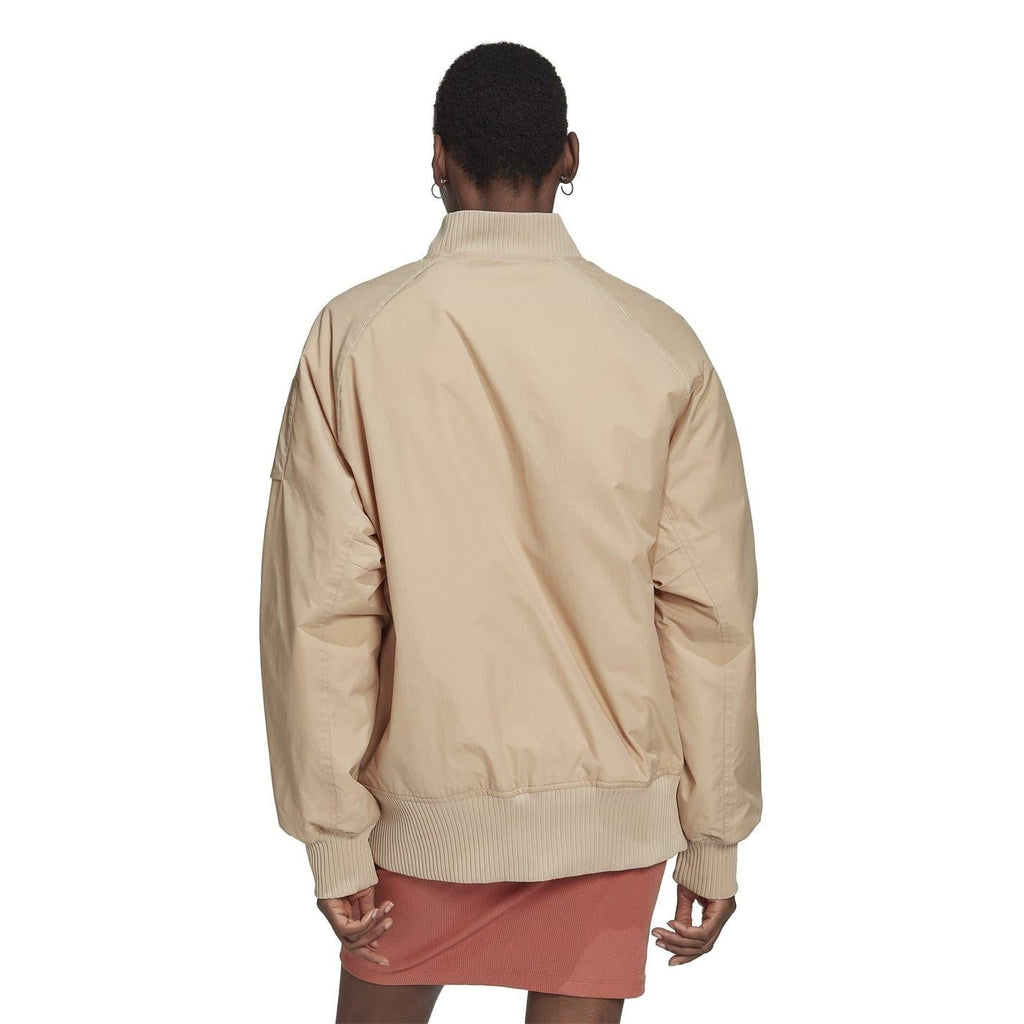 Beige bomber jacket, back view with stand collar and ribbed hem.