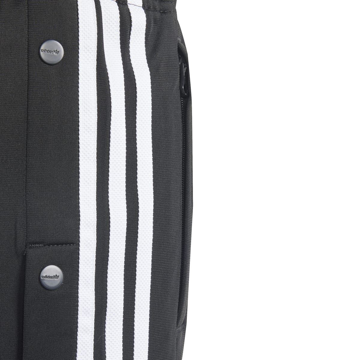 Black shorts with vertical white stripe panel and snap buttons along the side