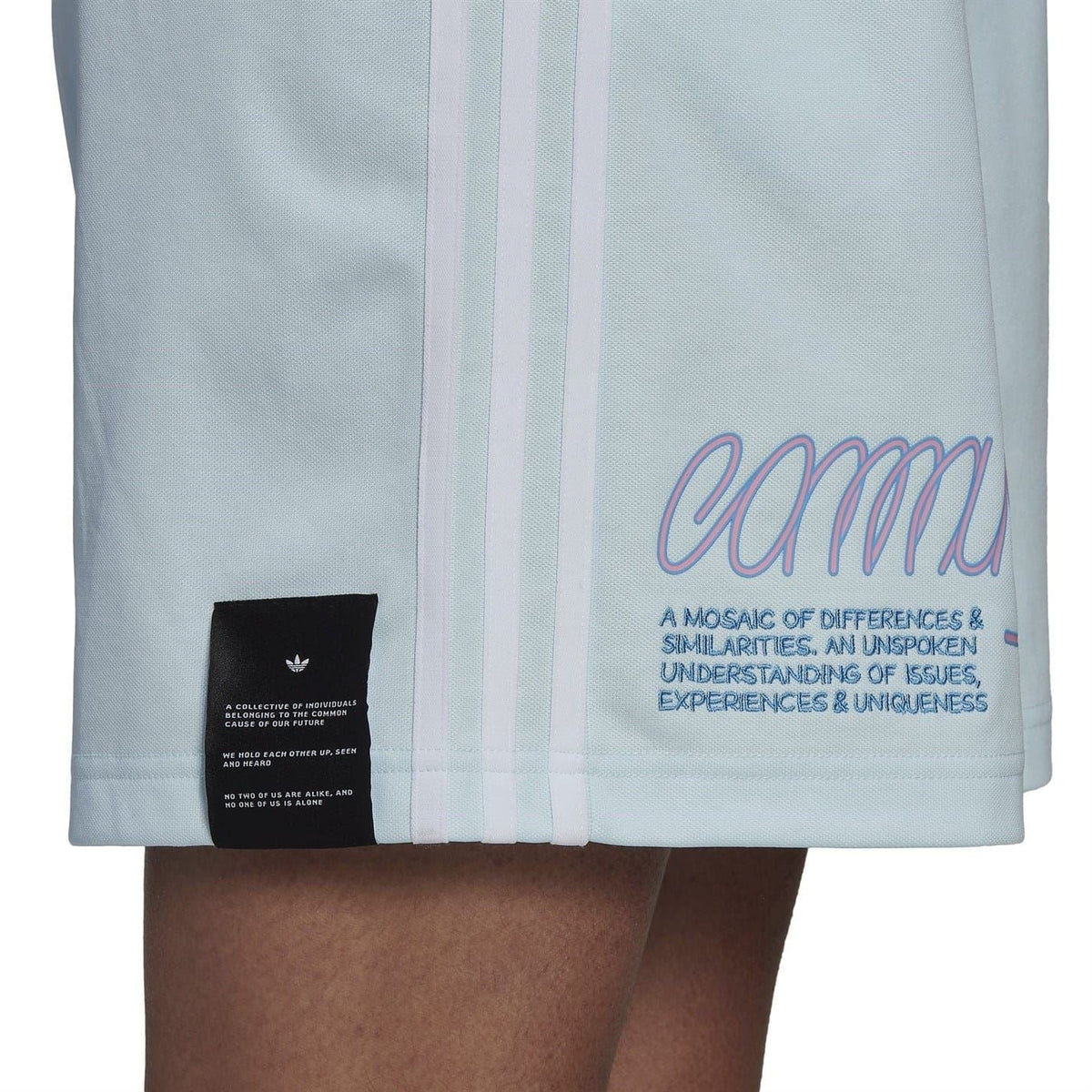 Light blue shorts with elastic waistband and adidas trefoil logo on the leg