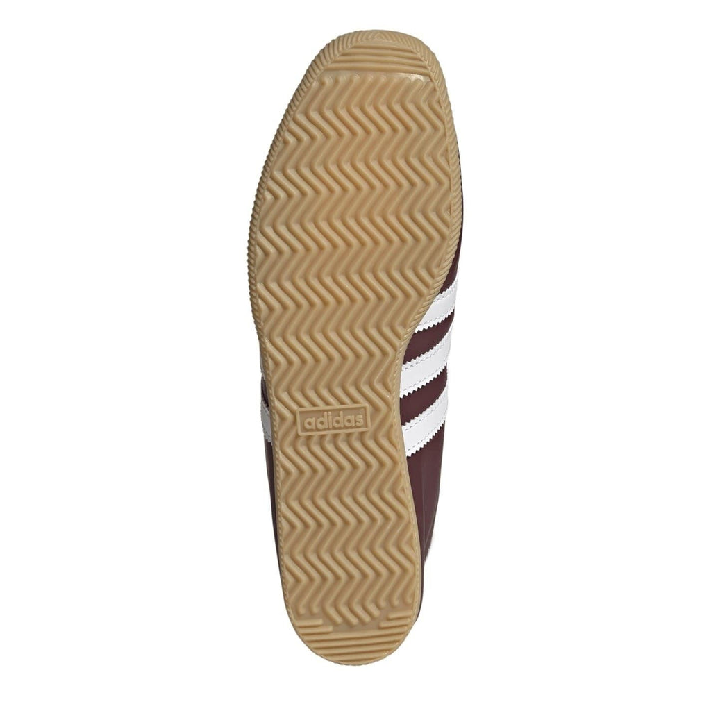 Gum rubber outsole with zigzag traction pattern for burgundy low top sneaker