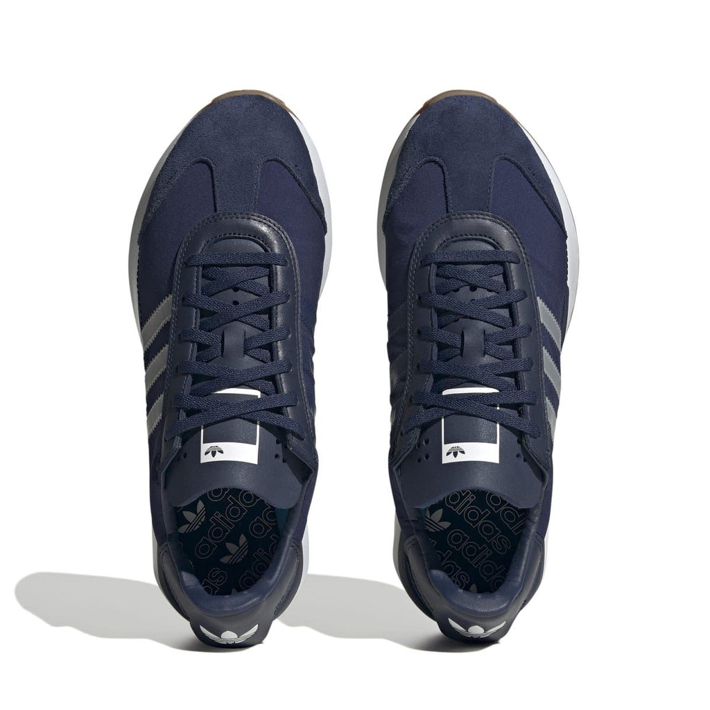 adidas Originals Courty XLG trainers with navy laces and side triple stripe pattern
