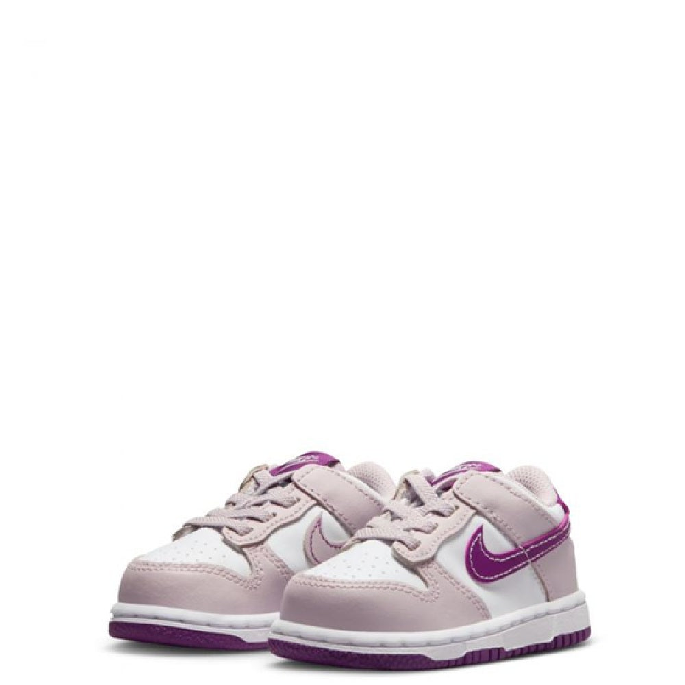 Pair of toddler Nike Dunk Low sneakers, pale pink uppers with violet trim and laces