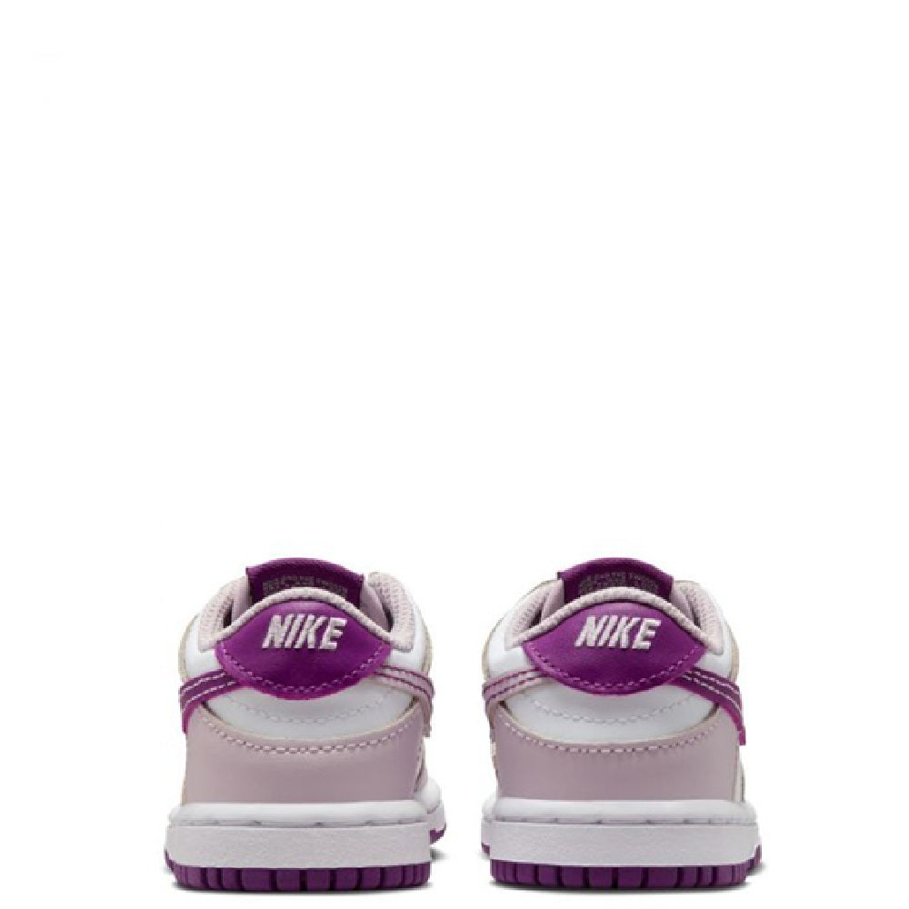 Toddler Nike Dunk Low sneakers, rear view with violet Nike text on heel tabs