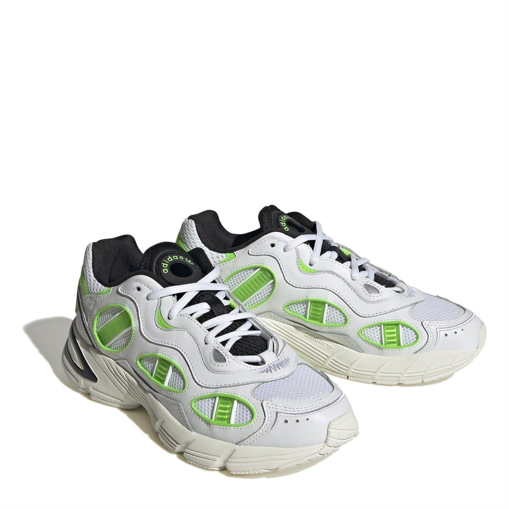 Two-tone white sneakers with neon green paneling, black collar lining, and thick sole