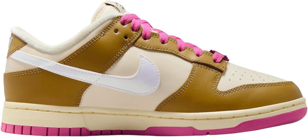 Low-top sneakers with gold panels, white swoosh, pink lace-up, and pink outsole