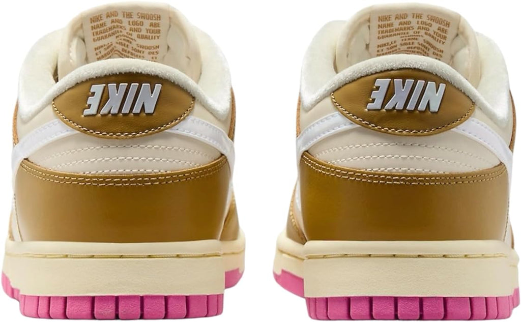 Low-top sneakers with gold heel logo detail, white back, and pink rubber sole