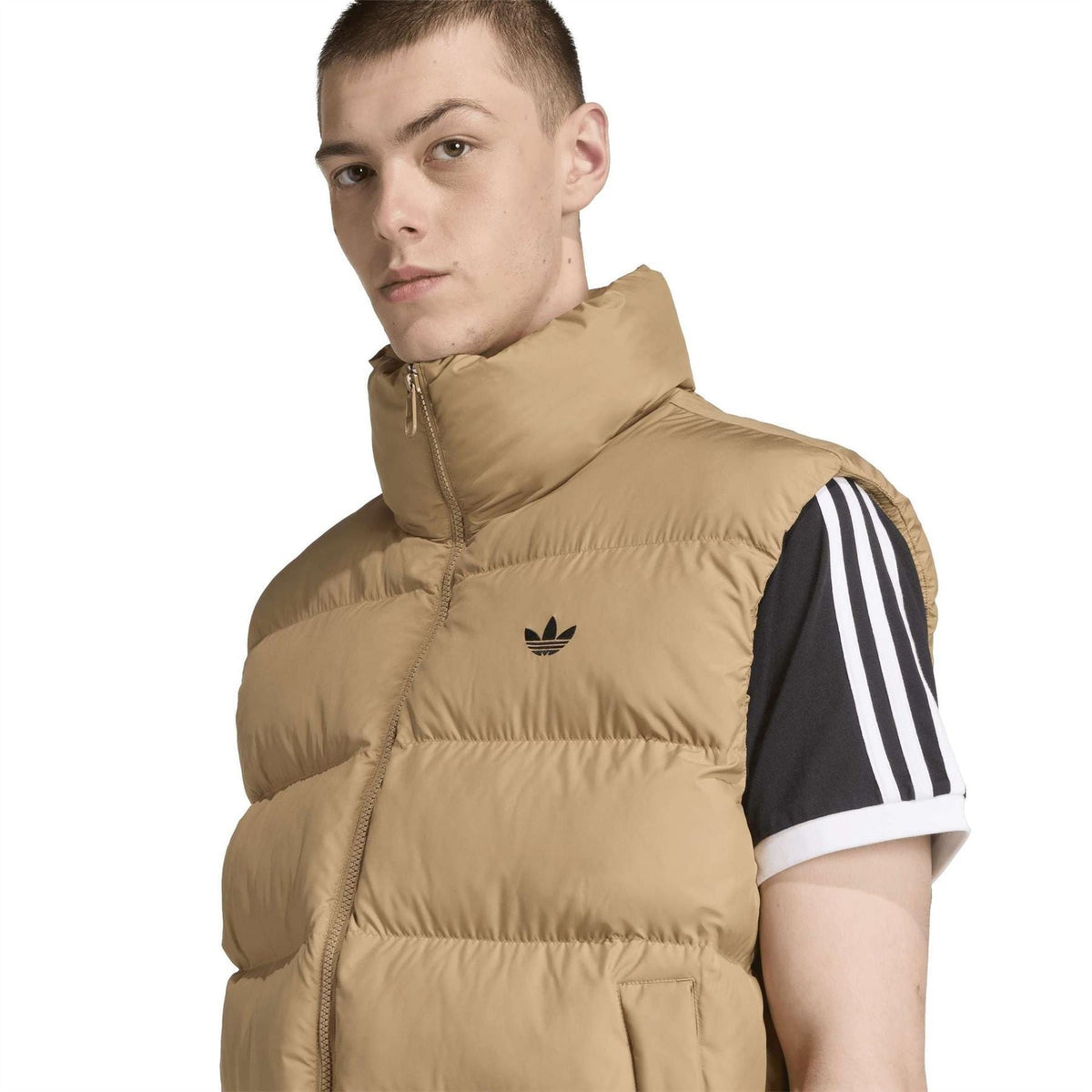 Tan puffer vest with adidas trefoil logo on chest, stand collar zip
