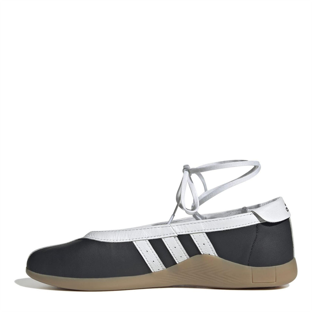 Taekwondo sneakers with black upper, white triple stripes, lace-up ankle fit, gum sole
