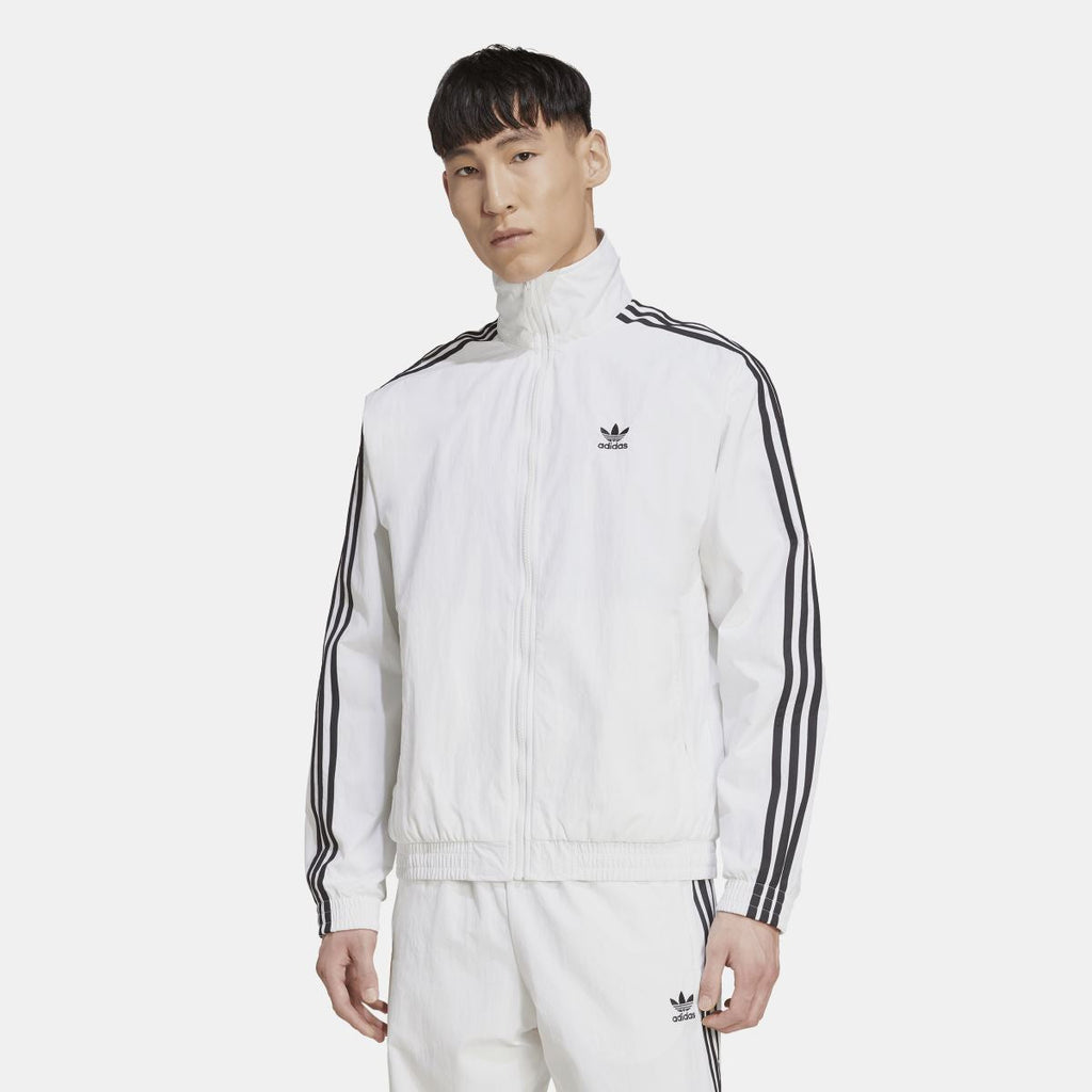 White adidas track top with stand collar, front zip, and black triple-stripe sleeve details