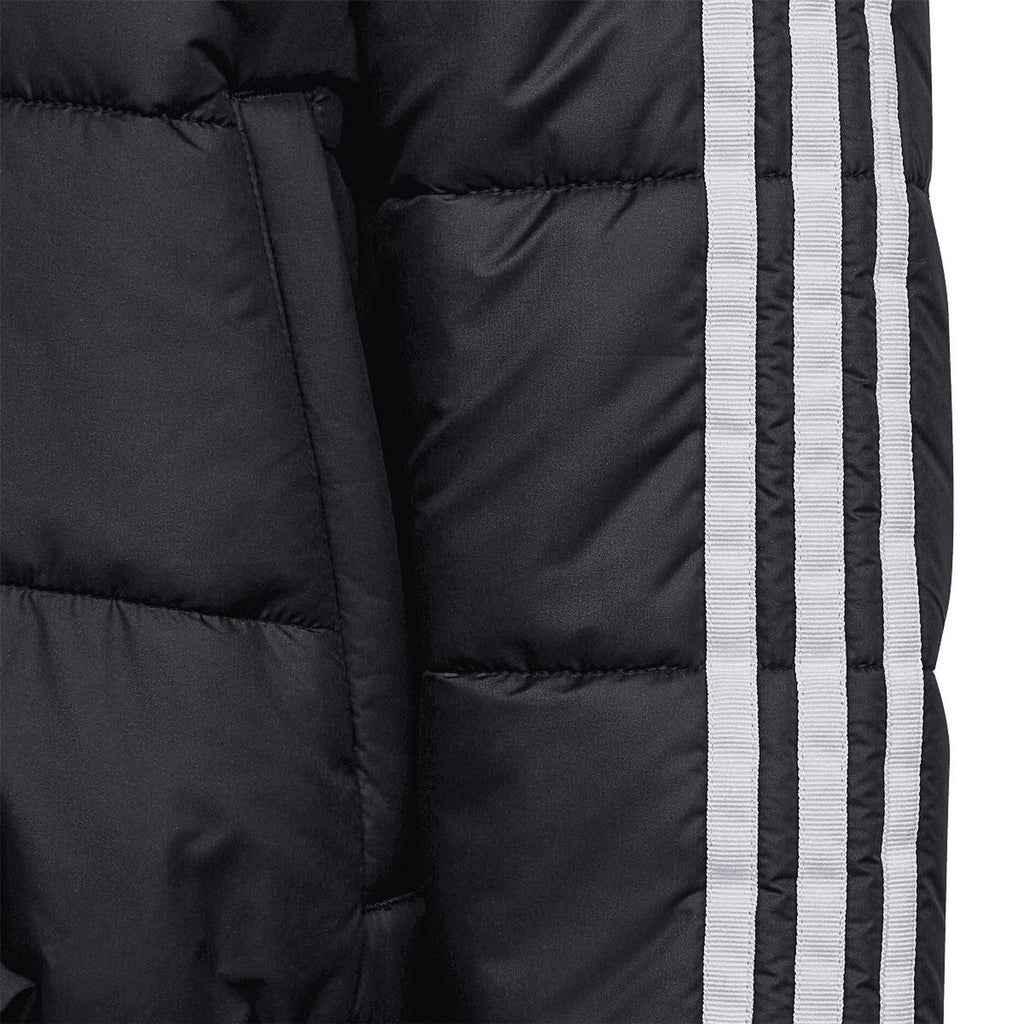 Black puffer jacket side seam with white three-stripe tape and quilted panels.