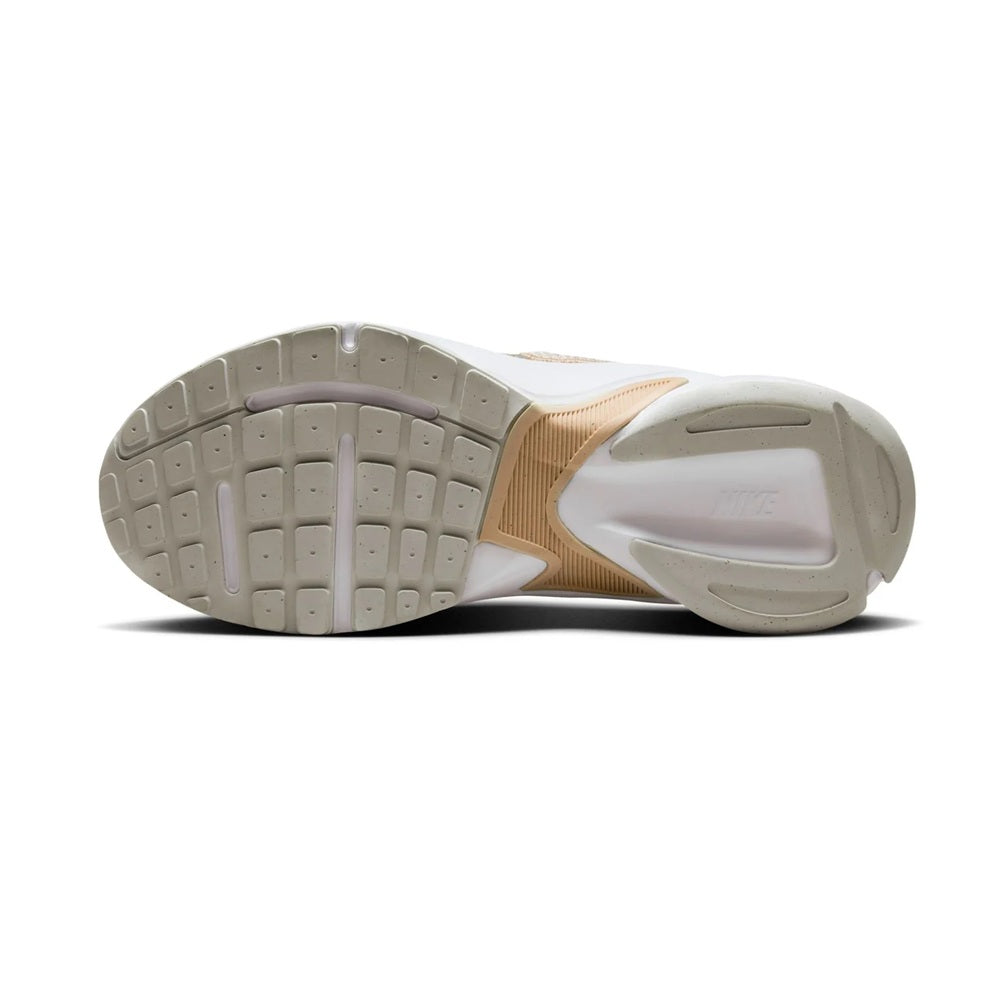 Nike women's running sneakers outsole view, patterned tread with white midsole