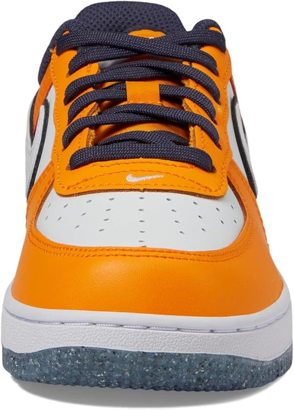 Kids' orange and white sneakers with navy laces, padded tongue, and lace eyelets