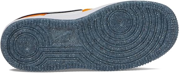 Kids' sneaker outsole in dark blue textured rubber with circular tread patterns