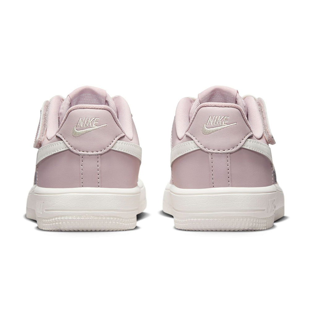 Kids sneakers heel view with Nike logo, padded collar, rose color and white sole