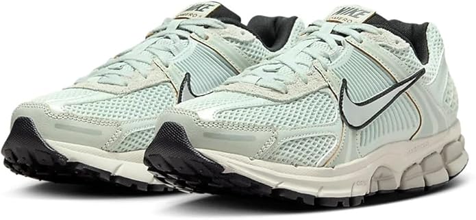 Women's Nike Zoom Vomero 5 lace-up sneakers, light silver/blue knit upper, black outsole.