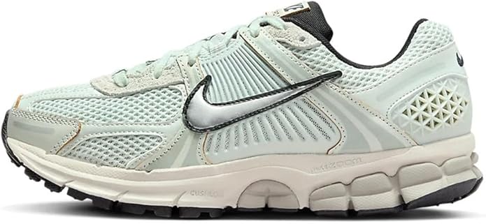 Women's Nike Zoom Vomero 5 running shoes in light silver with black swoosh, lace-up.