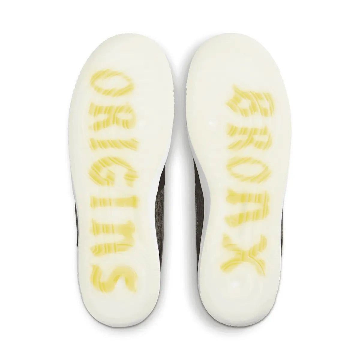 White shoe soles with yellow printed text on black kids low-top sneakers