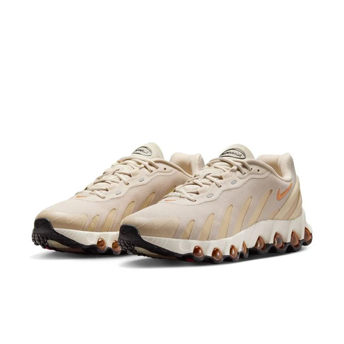 Light khaki lace-up sneakers with side stripes and large cushioned pod sole