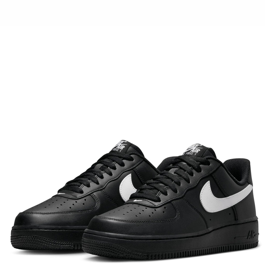 Pair of black Nike Air Force 1 '07 sneakers with white swoosh and lace-up