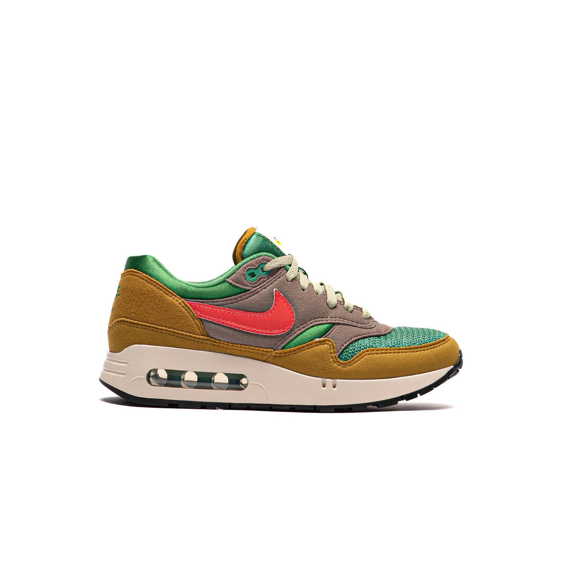 Air Max 1 PRM sneakers with green-brown upper, red swoosh, and visible air unit