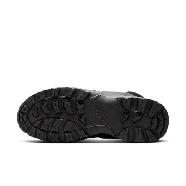 Men's Nike black boot outsole with deep tread and rugged rubber texture