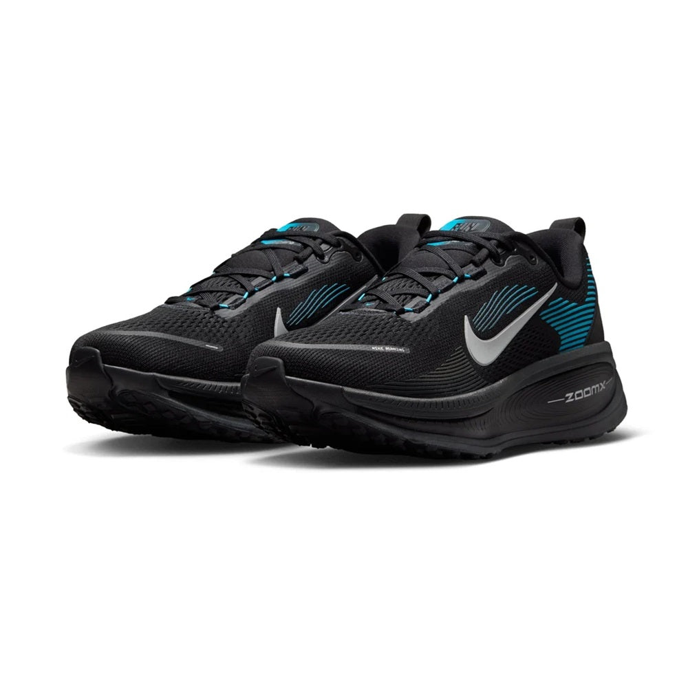 Pair of men's running shoes, black uppers with silver swoosh and light blue details