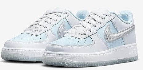 Pair of kids' Nike Air Force 1 sneakers with light blue heel and silver swoosh