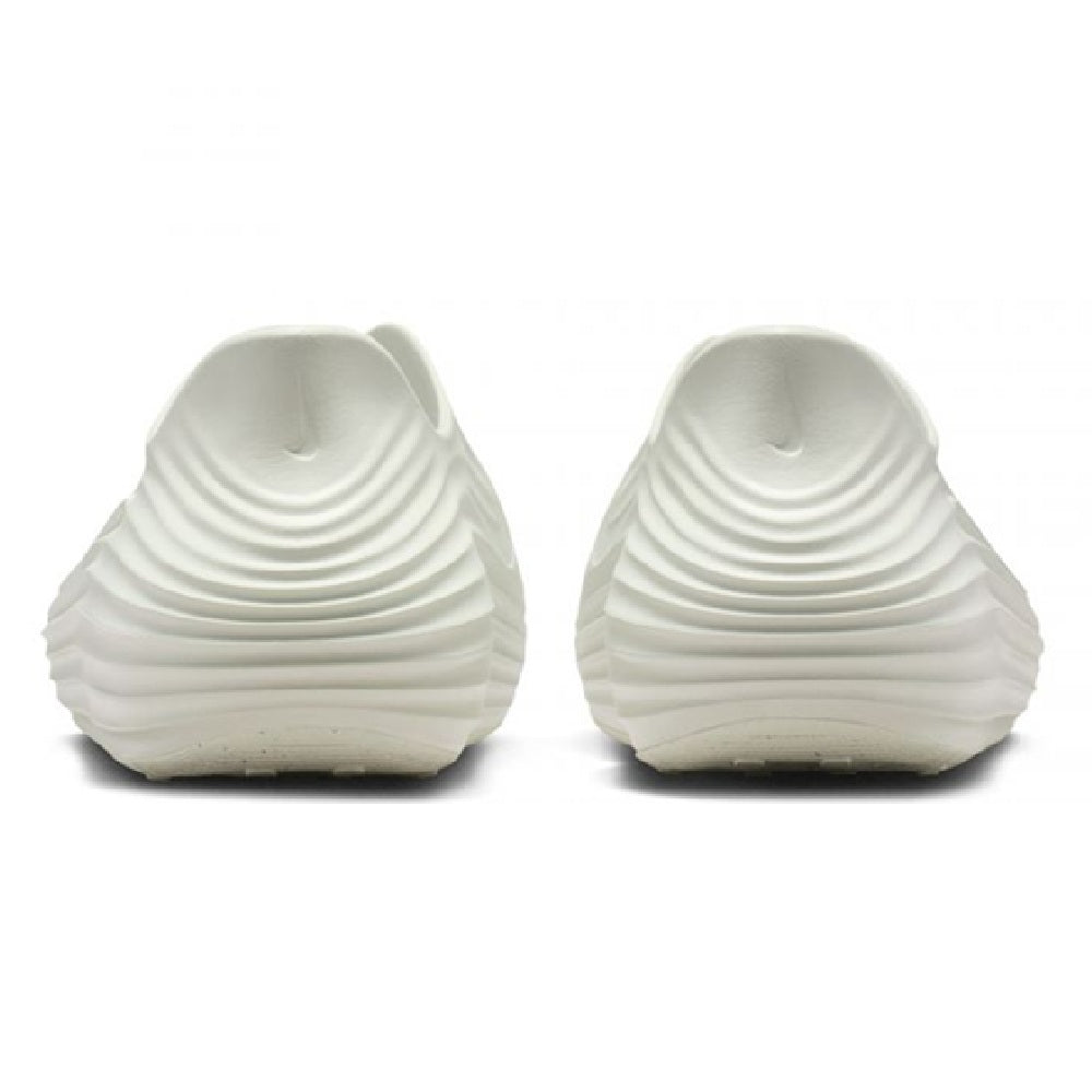 Men's Nike ReactX slip-on sneakers, white heel view with ribbed foam design