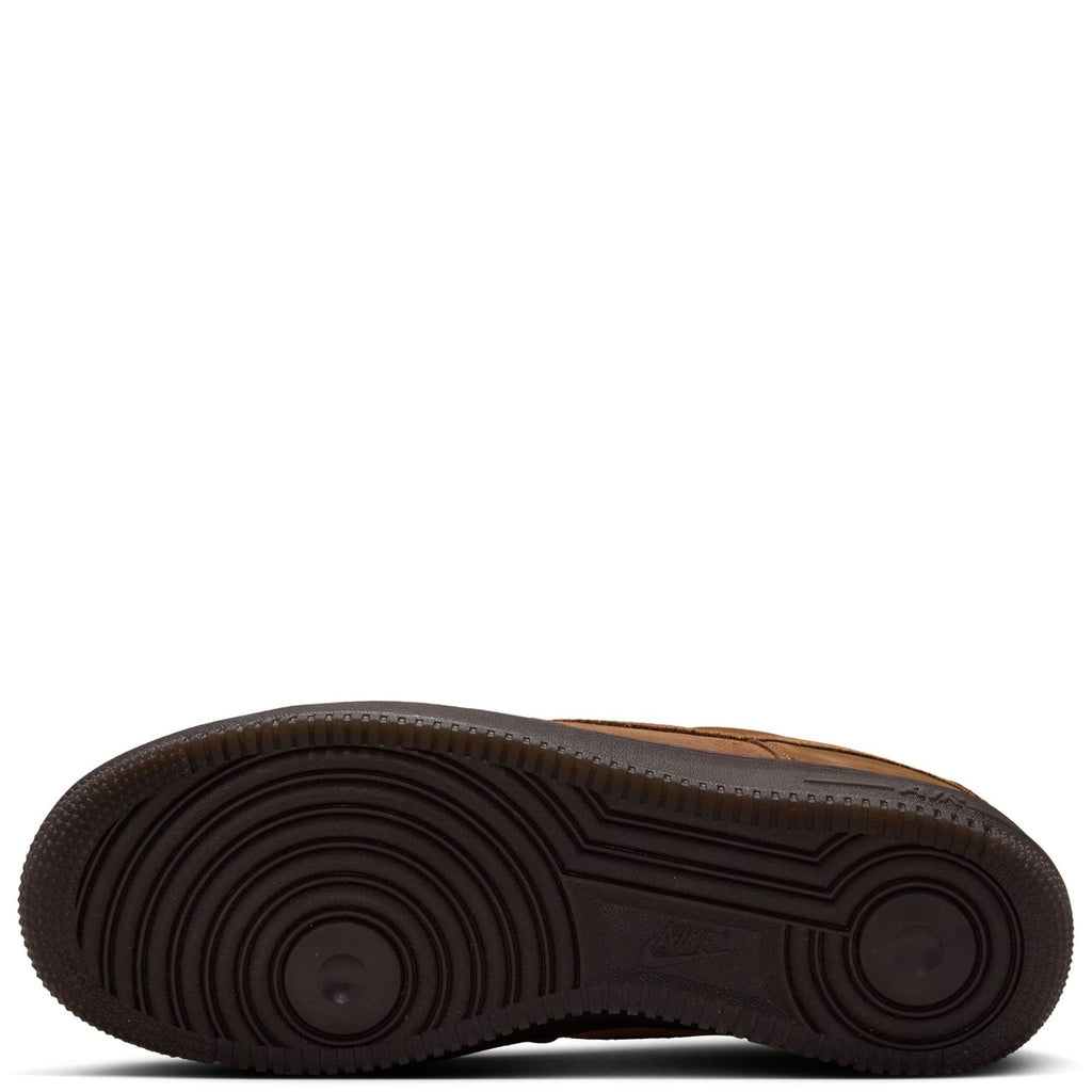 Nike Air Force 1 gum rubber outsole with deep circular traction tread.