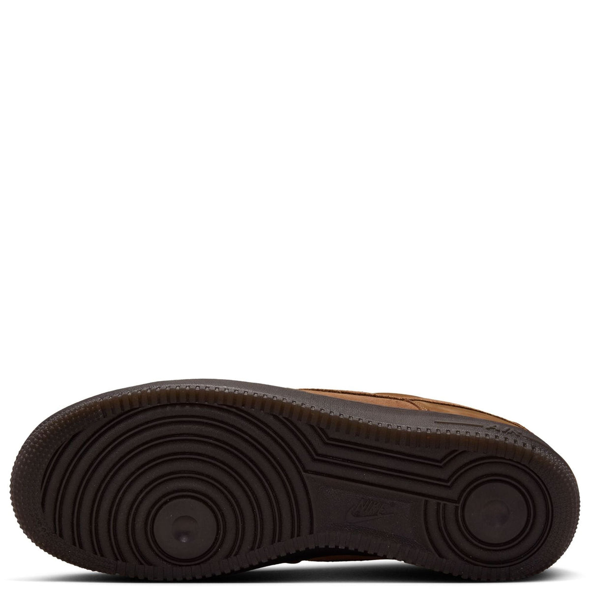 Nike Air Force 1 gum rubber outsole with deep circular traction tread.