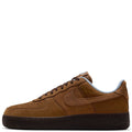 Men's Nike Air Force 1 low-top sneakers, tan suede with blue collar and lace-up design.
