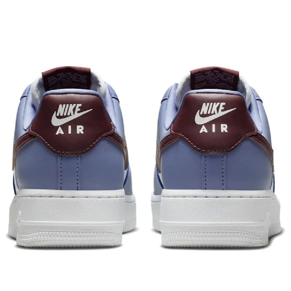 Sneaker heel view in light blue with white midsole and Nike Air branding