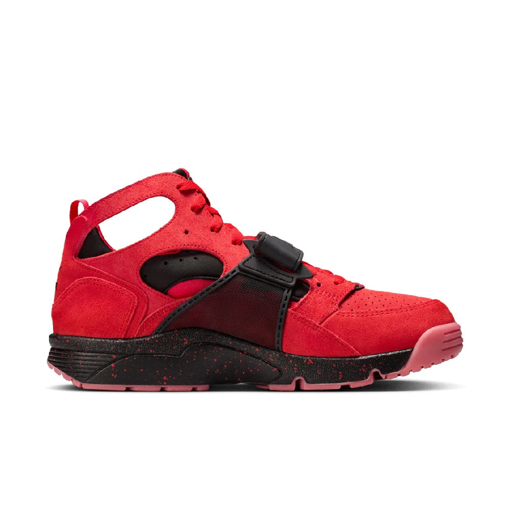 Red and black Nike high-top sneakers with perforated suede and side buckle strap