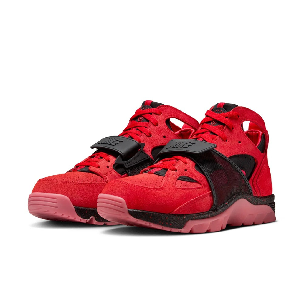 Pair of red and black Nike high-top sneakers with lace-up front and chunky sole