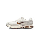 Men's Nike Air Max sneakers in white with brown swoosh and tan accents, side view