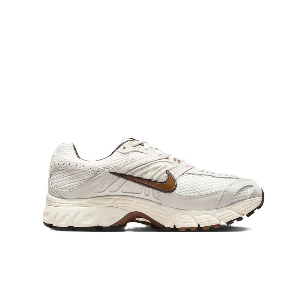 Men's Nike Air Max sneakers in white with brown swoosh, angled side profile