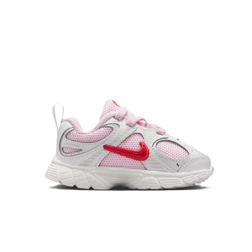 Kids' Nike running shoes in white, pink mesh, and red Swoosh with lace-up design