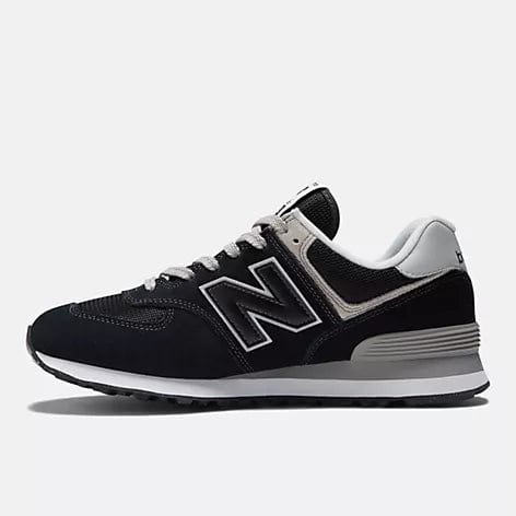 Black low-top sneakers with gray midsole, white N logo, and lace-up front