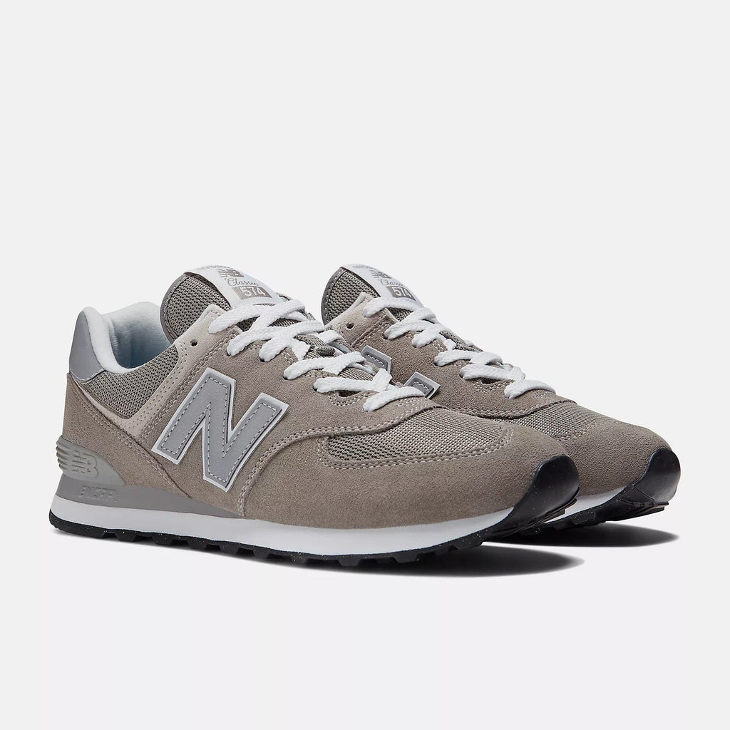New Balance 574 sneakers in taupe suede with white N logo and lace-up front
