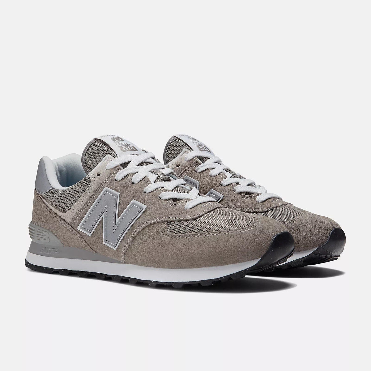 New Balance 574 sneakers in taupe suede with white N logo and lace-up front