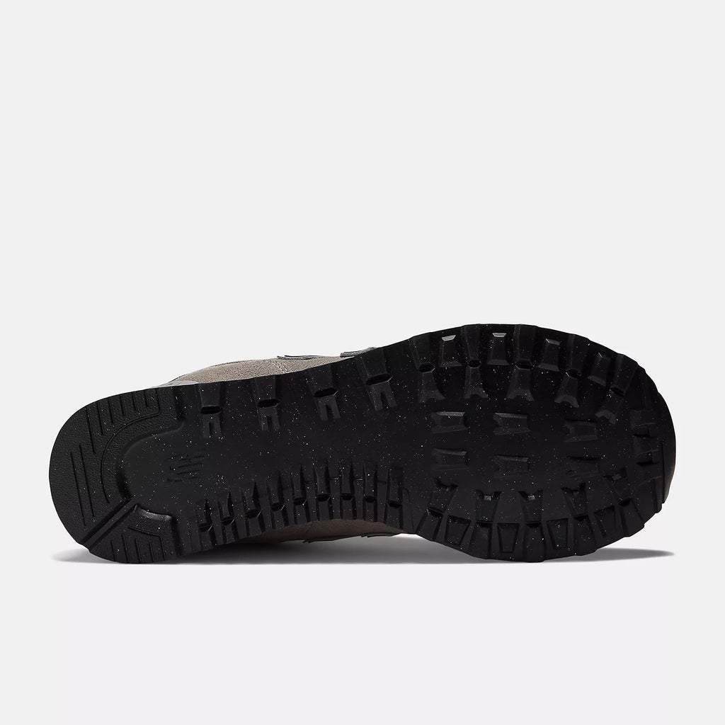 Black sneaker outsole with deep textured rubber tread for traction