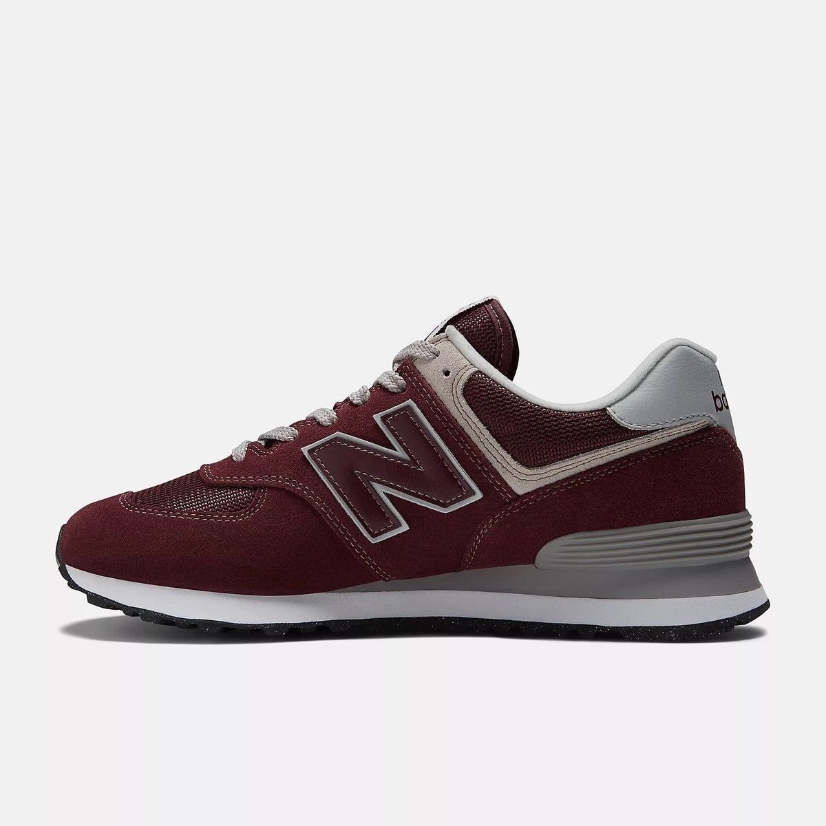 Burgundy suede sneakers with gray trim, N logo, and grippy rubber outsole
