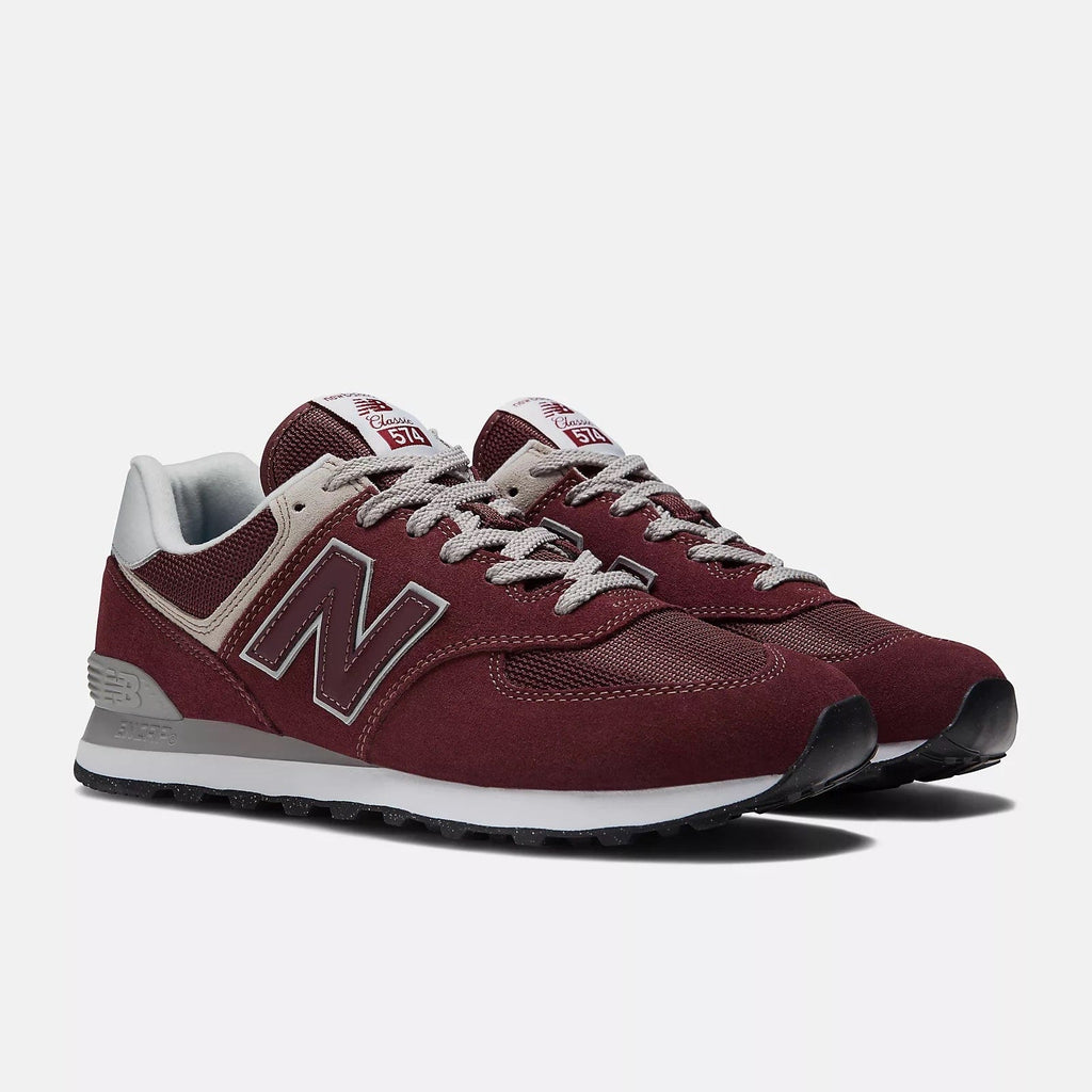 Burgundy low-top sneakers with gray laces, N logo, and cushioned sole