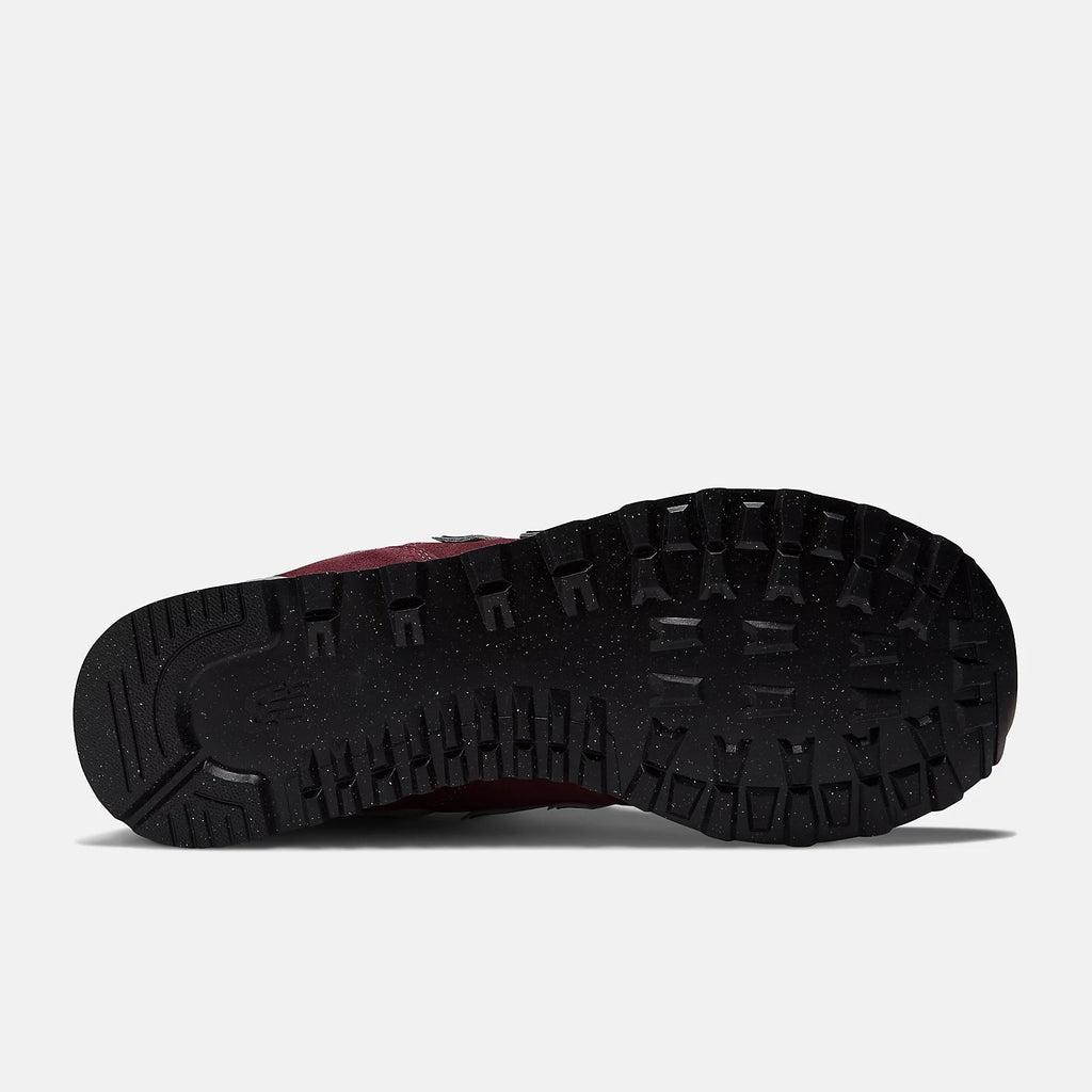 Burgundy sneaker outsole underside with black traction tread