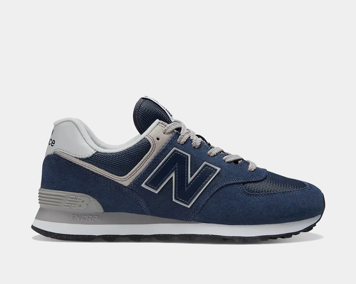 New Balance 574 sneakers in navy blue with gray and white details, side view