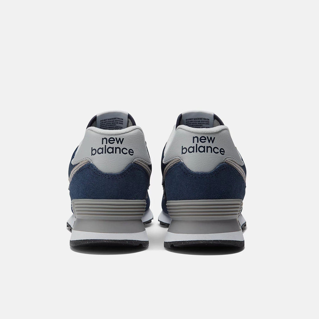New Balance 574 sneakers, navy blue with light gray heel tabs and new balance print