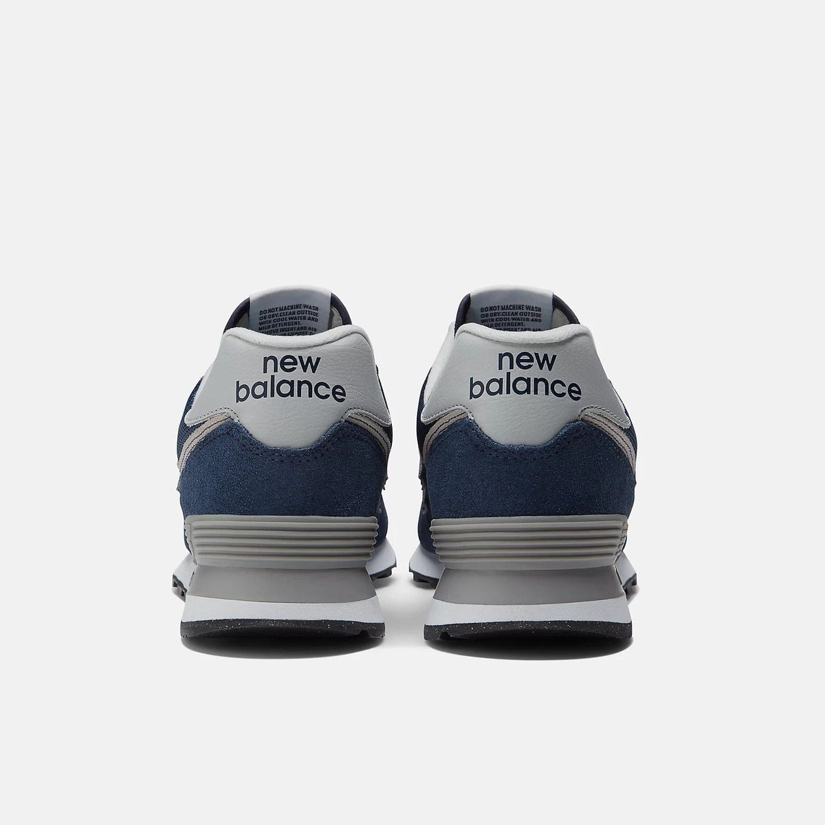 New Balance 574 sneakers, navy blue with light gray heel tabs and new balance print