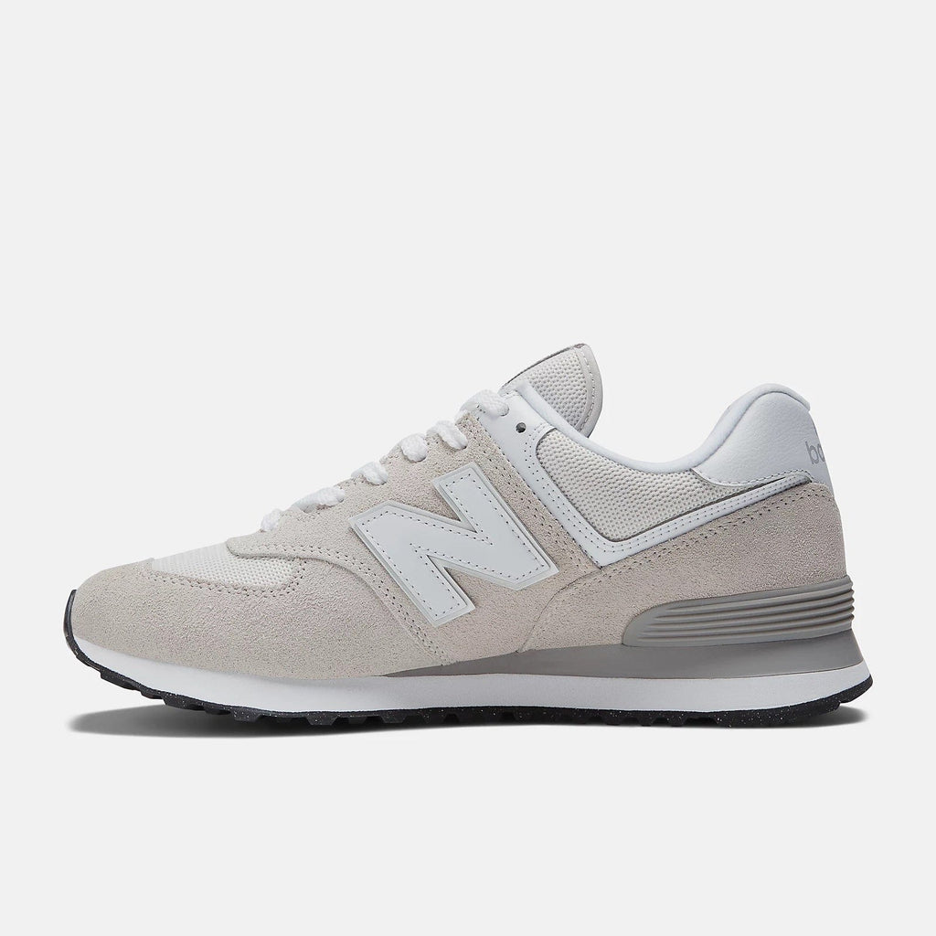 Light grey lace-up sneakers with suede overlays, white N logo, and grey sole