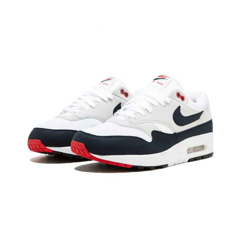 Nike Air Max 1 running shoe, white with navy panels and red air unit