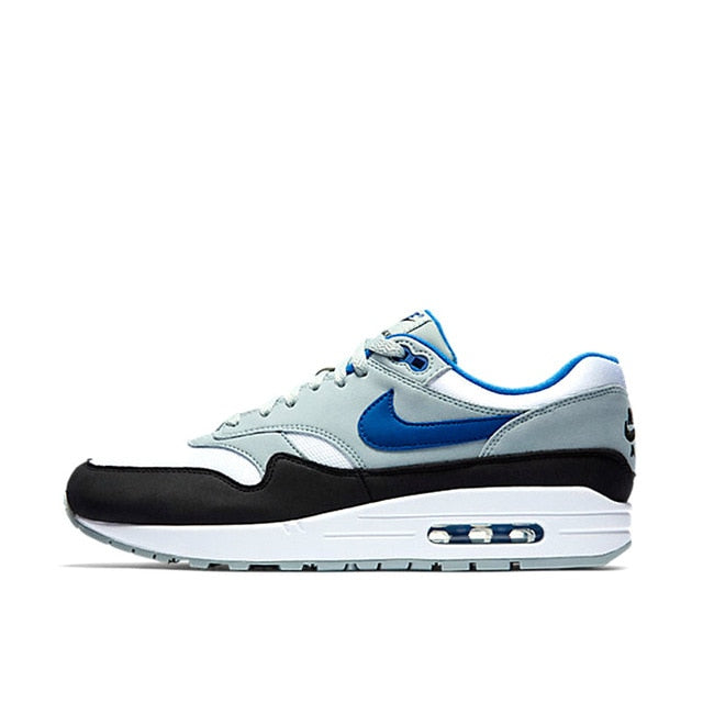 Nike Air Max 1 running shoe, light gray with blue swoosh and black toe